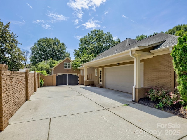 view of side of property with a garage