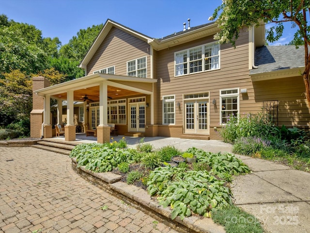 back of property featuring french doors and ceiling fan