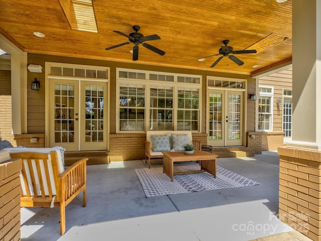 view of patio / terrace featuring french doors, an outdoor living space, and ceiling fan