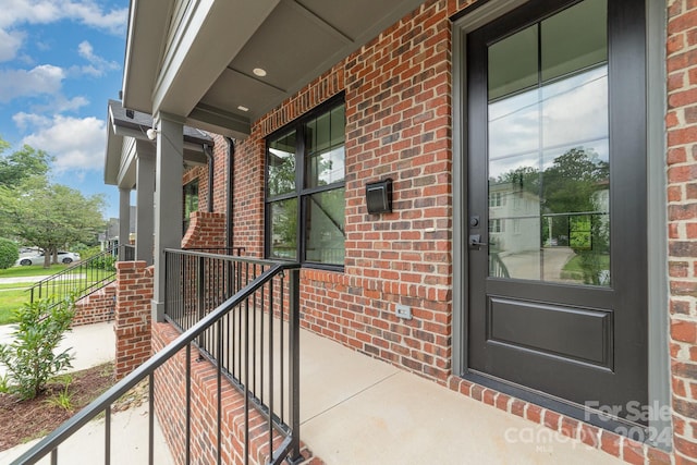 entrance to property featuring a porch