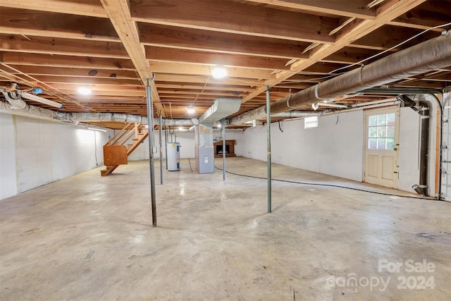 basement with electric water heater and heating unit