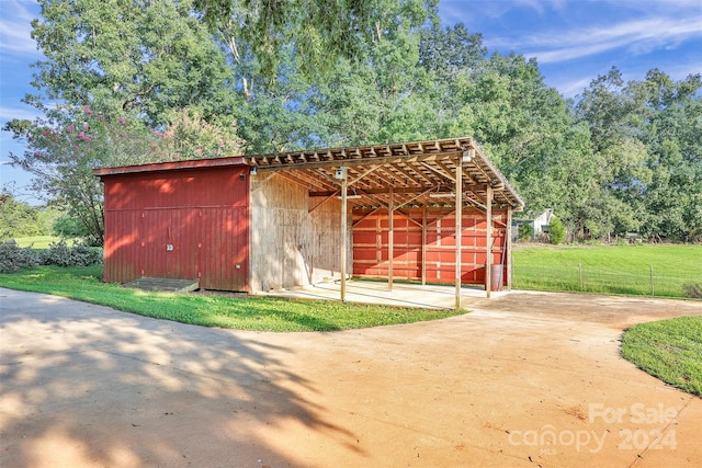 view of outbuilding with a lawn