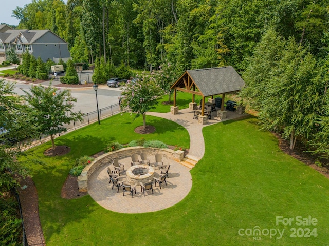 exterior space featuring a patio, a fire pit, and a gazebo