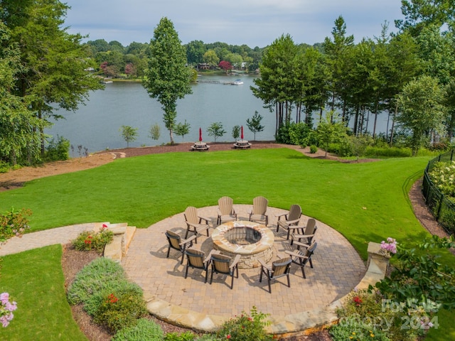 view of patio / terrace with a water view and an outdoor fire pit