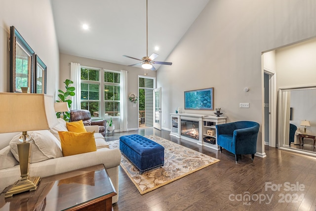 living room featuring ceiling fan, wood-type flooring, and high vaulted ceiling