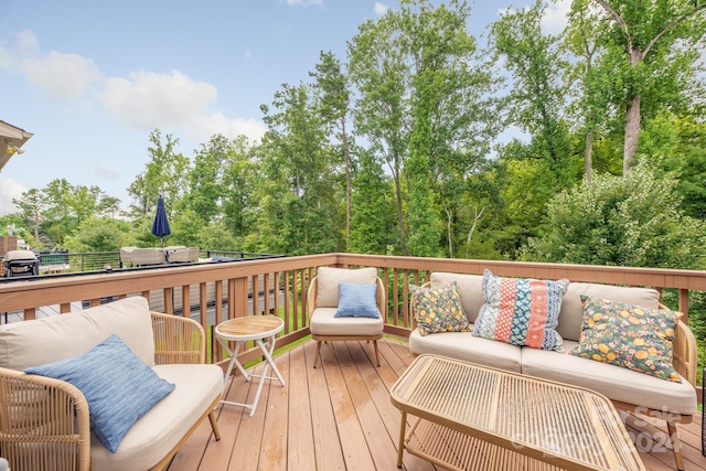 wooden terrace with outdoor lounge area