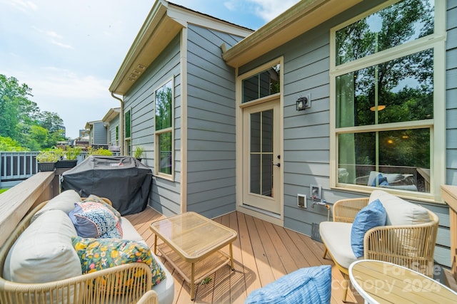 wooden terrace featuring grilling area