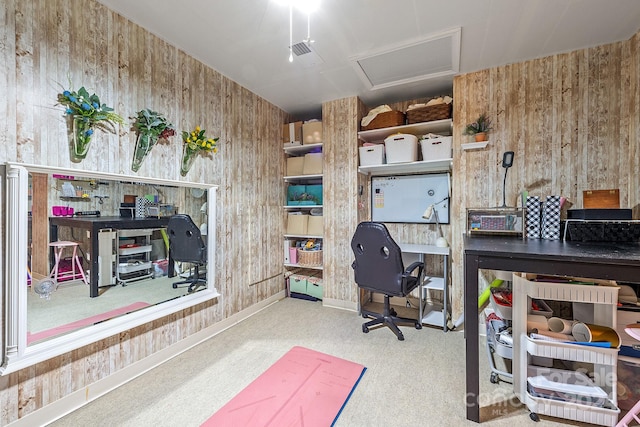 home office with wood walls and carpet flooring