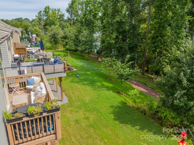 view of yard with a deck and an outdoor living space