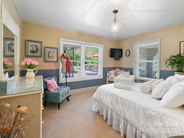 bedroom featuring ornamental molding, multiple windows, and wallpapered walls