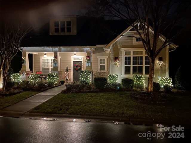 view of front of home with a yard