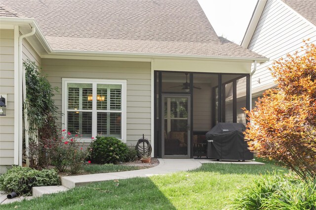 property entrance with a lawn