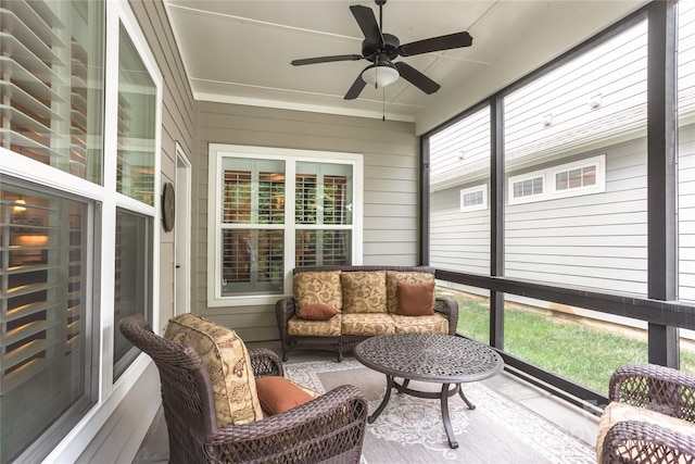 sunroom / solarium featuring a ceiling fan