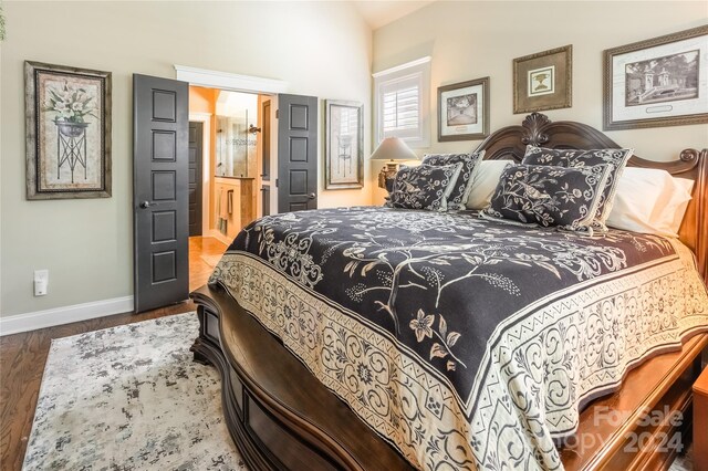 bedroom with hardwood / wood-style floors