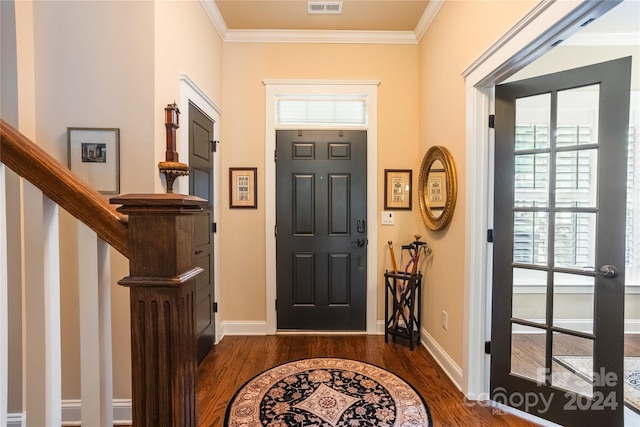 entrance foyer featuring dark wood-style floors, crown molding, visible vents, stairway, and baseboards