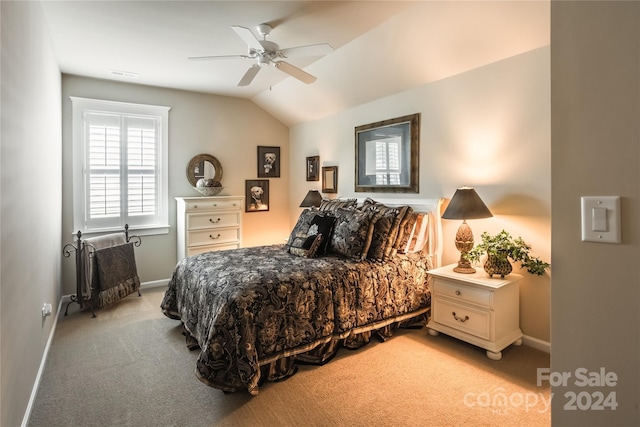 bedroom with baseboards, visible vents, vaulted ceiling, and light colored carpet