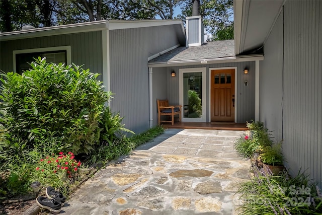 doorway to property with a patio area