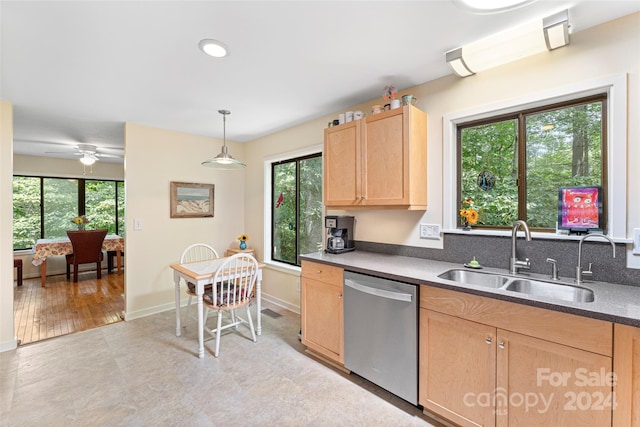 kitchen featuring light brown cabinets, ceiling fan, stainless steel dishwasher, light wood-type flooring, and sink