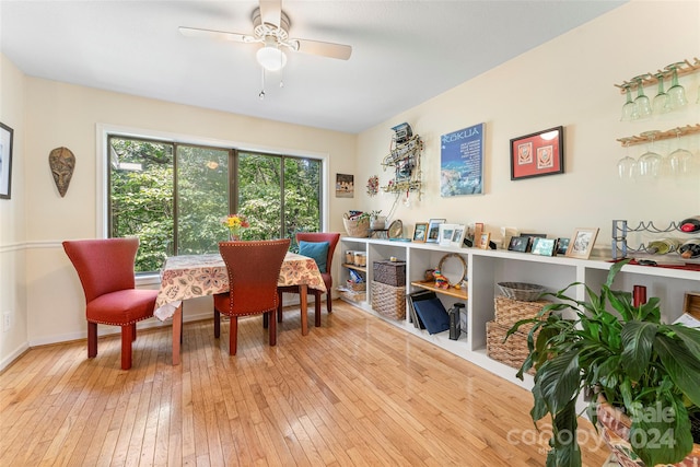 sitting room with ceiling fan and light hardwood / wood-style flooring