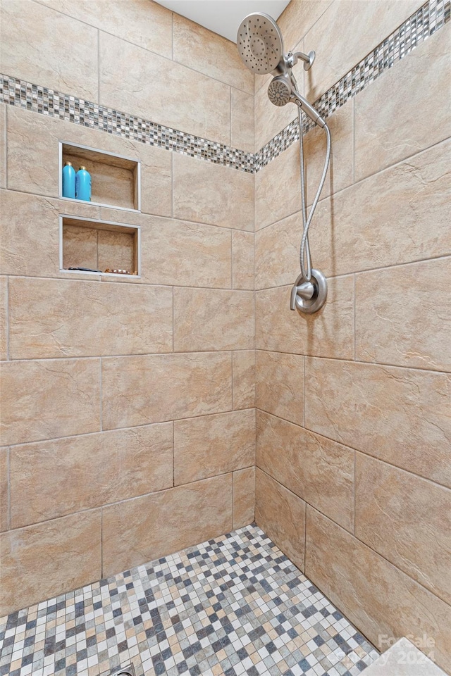 bathroom with tiled shower