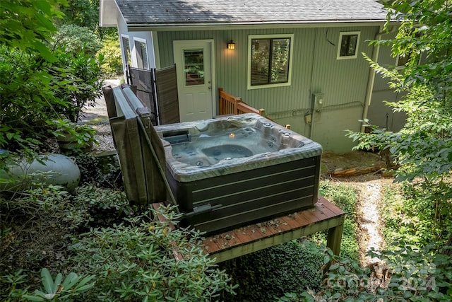 exterior space featuring a hot tub