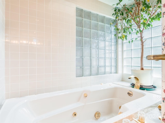 bathroom featuring a tub to relax in