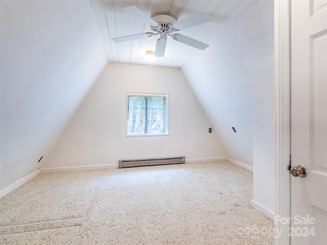 additional living space with ceiling fan, a baseboard radiator, carpet flooring, and vaulted ceiling