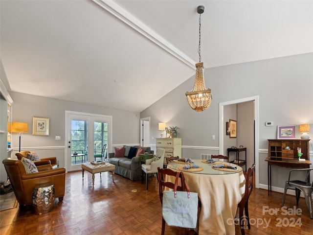 dining space featuring a notable chandelier, french doors, parquet floors, and high vaulted ceiling