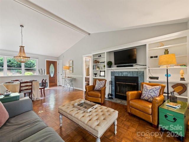 living room with a tiled fireplace, lofted ceiling with beams, dark parquet floors, and a chandelier