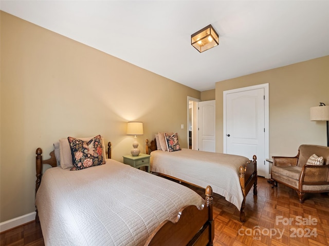 bedroom featuring parquet floors