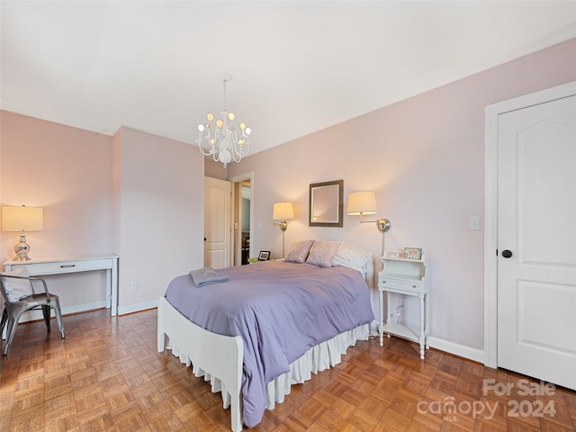 bedroom with a chandelier and parquet flooring