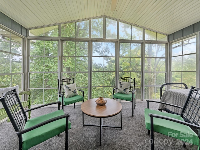 sunroom with vaulted ceiling and wood ceiling