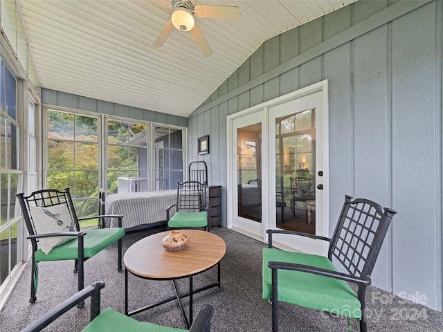 sunroom / solarium with ceiling fan and vaulted ceiling