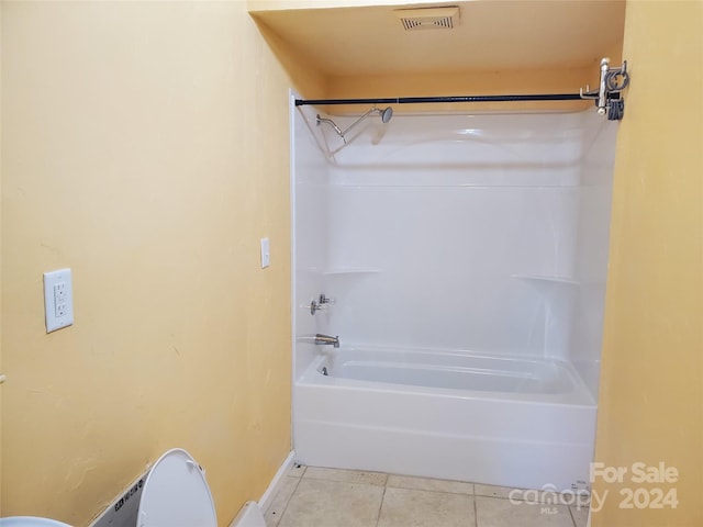 bathroom featuring tile patterned floors and  shower combination