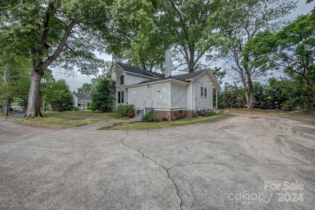 view of side of property featuring crawl space