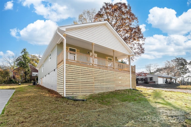 view of property exterior with a lawn and central AC unit