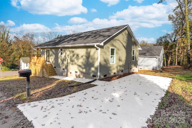 view of home's exterior with a shed