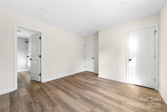 unfurnished room with light hardwood / wood-style flooring