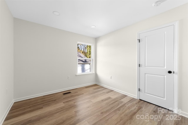 empty room with light wood-type flooring