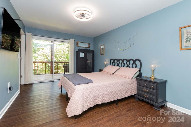 bedroom featuring dark wood-style floors, access to outside, and baseboards