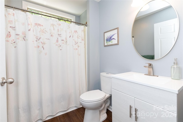 bathroom with a shower with curtain, vanity, toilet, and wood finished floors