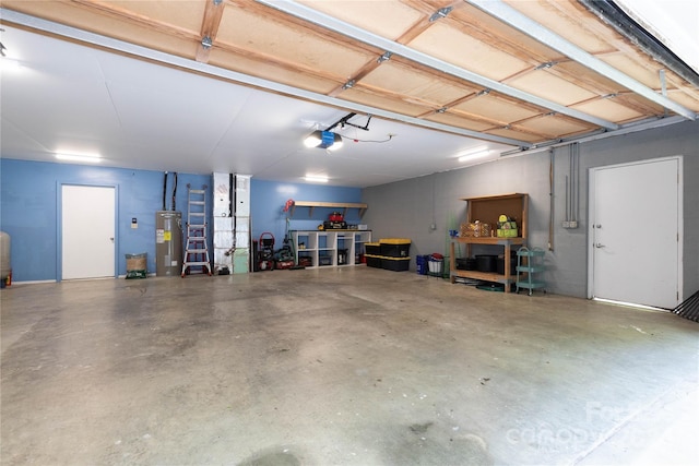 garage featuring a garage door opener and electric water heater