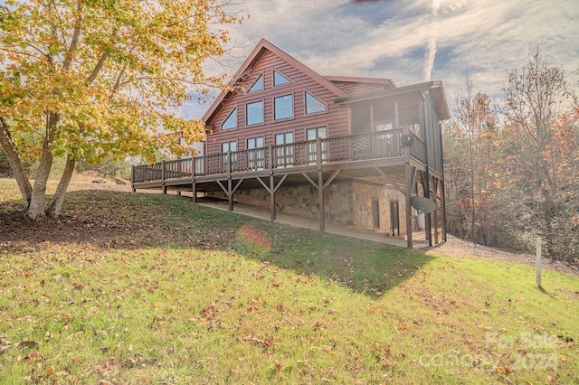 back of house with a yard and a deck