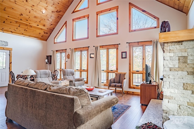 living room with high vaulted ceiling, wood ceiling, and dark hardwood / wood-style floors