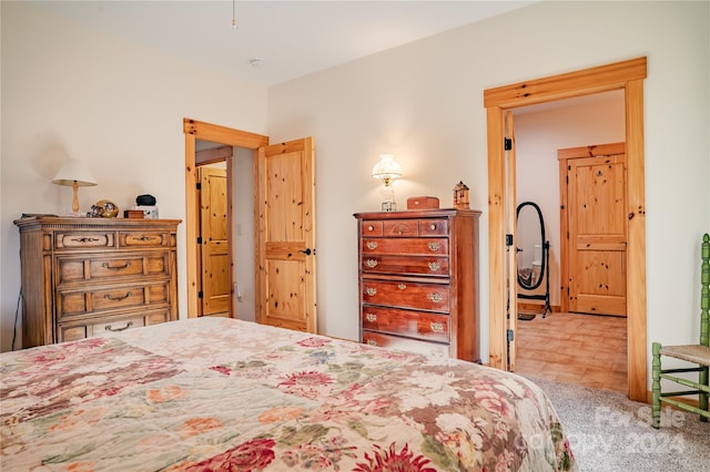 bedroom featuring light colored carpet