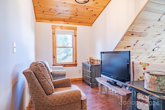 sitting room featuring hardwood / wood-style floors, wooden ceiling, and lofted ceiling