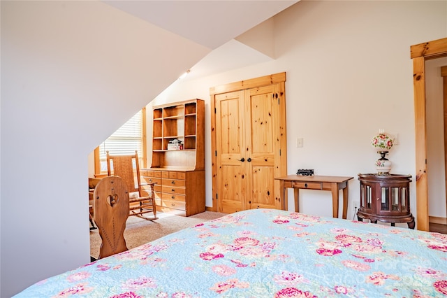 bedroom featuring light carpet