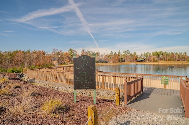 dock area with a deck with water view