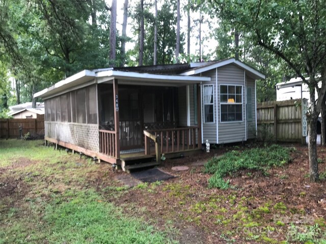 view of front facade featuring a sunroom