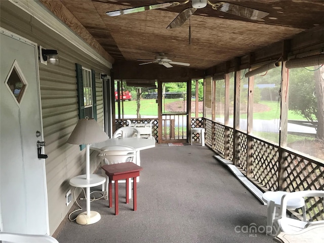 sunroom / solarium with ceiling fan